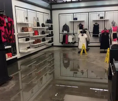 Standing water across the floor of a retail store in Fresh Meadows